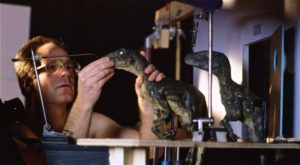 Randal Dutra, award-winning animation professional, posing raptor puppets for Phil Tippet's Jurassic Park animatics.
