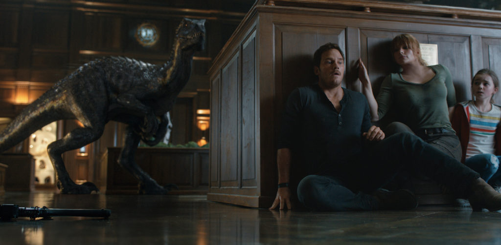 Still of the Indoraptor hunting Chris Pratt, Bryce Dallas Howard, and Isabella Sermon in Jurassic World: Fallen Kingdom, 2018